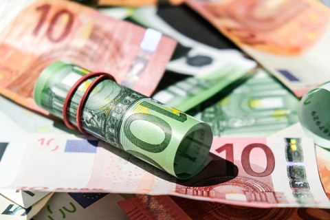 Close up of Euro money roll. Euro banknote set cash money, EU currency. Rolled with rubber euro
