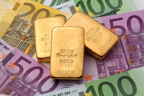Investment in real gold with gold bars and euro banknotes, 250 gram gold bar studio recording,