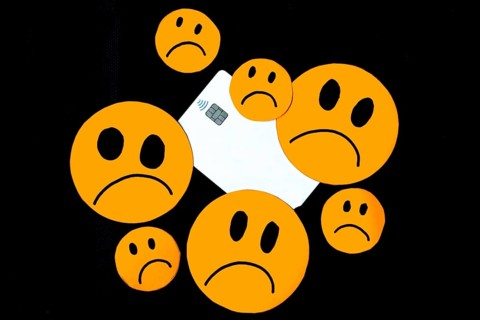 Illustration of discontent, scam, disappointment with bank credit cards represented with sad orange