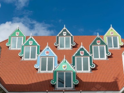 Roof with 7 triangular pointed dormer windows of the town hall (Stadhuis Zaanstad), Zaandam, North