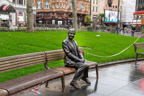 London, UK, March 22, 2024 : Statue of Mr Bean sitting on a bench. Rowan Atkinson bronze statue in