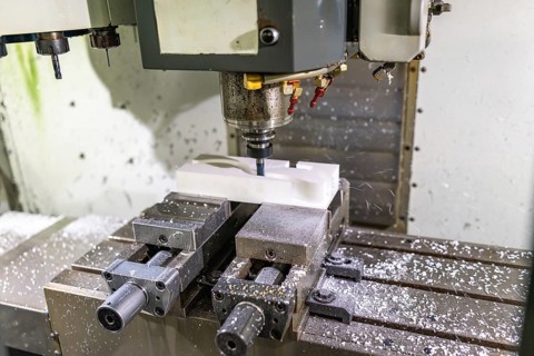 Close-up of a mechanical machine to mold plastic parts with no people