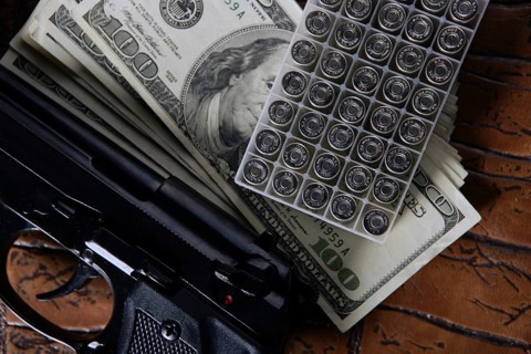 Dollar notes and gun, black pistol, mafia inspiration