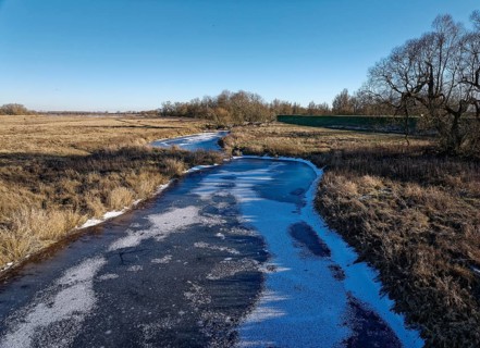 Icy drainage ditch on a winter's day in the floodplains of the Elbe valley near Neu Goldbeck.