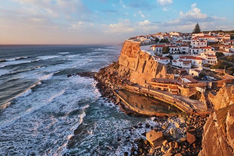 Scenic view of the seaside Azenhas do Mar fishing village on cliff on Atlantic ocean coast,