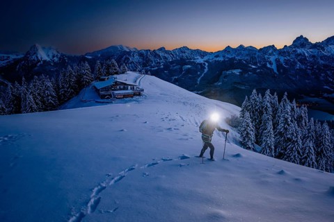Hiking in the snow in the snow-covered winder landscape in the Alps at Neunerköpfle in the