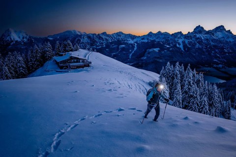 Hiking in the snow in the snow-covered winder landscape in the Alps at Neunerköpfle in the