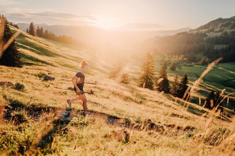 Summer trail running and hiking in the Alps on the Riedberg Pass between Obermaiselstein and