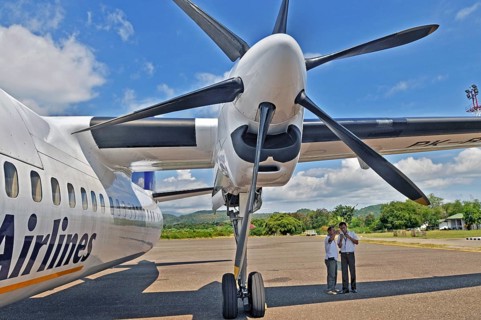 Propeller aircraft, Jet-Prop Fokker 50, former Riau Airlines, at the airport in Labuan Bajo, Flores
