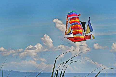 A flying dragon in the shape of a ship against a blue sky, Bali, Indonesia, Asia