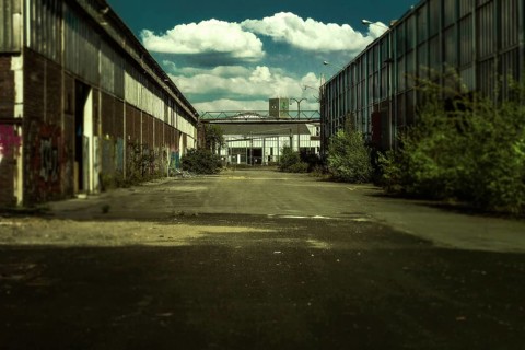 Abandoned industrial site with graffiti under a cloudy sky, Gerresheimer Germany, Lost Place,