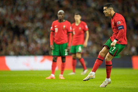 Football match, captain Cristiano RONALDO CR7 Portugal shoots the free kick with his right foot and