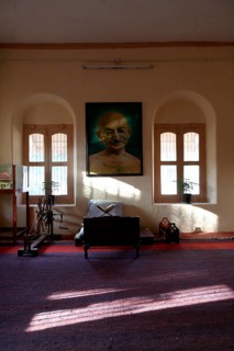Mahatma Gandhi sitting place with his large photograph and his charkha at Satyagraha Ashram founded