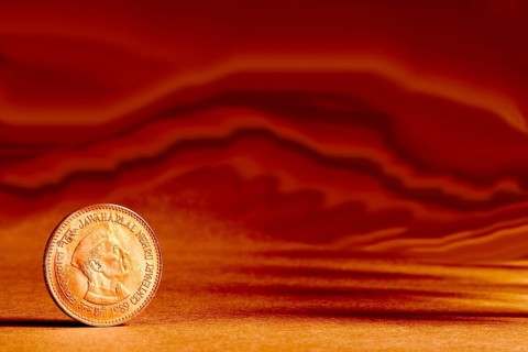 One single Indian currency five rupees coin and artistic background backside embossed Jawaharlal