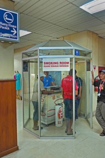 Smoking room with smoking locals, airport, Denpasar, Bali, Indonesia, Asia