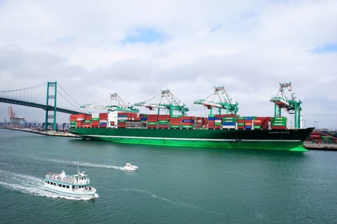 Cargo ship near the Vincent Thomas bridge completed in 1961 and opened to traffic1963, only