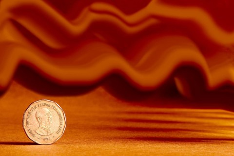One single Indian currency two rupees coin and artistic background backside embossed Sardar