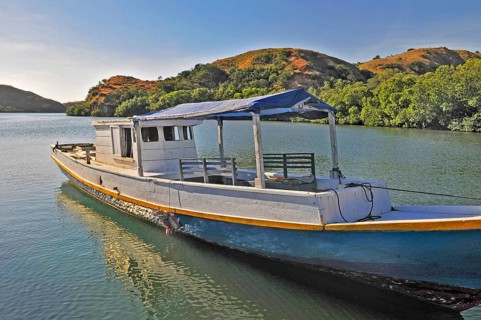 Simple typical wooden boat at the jetty, Rinca Island, Loh Buaya, Komodo National Park, Indonesia,