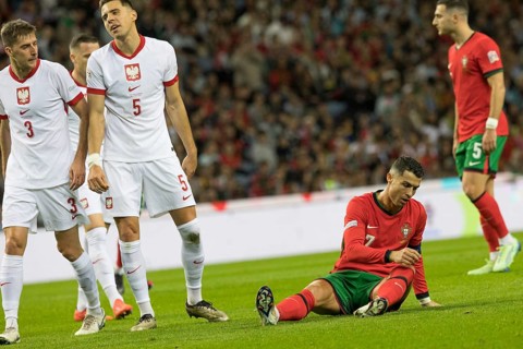 Football match, captain Cristiano RONALDO CR7 Portugal right has just been fouled and is sitting on