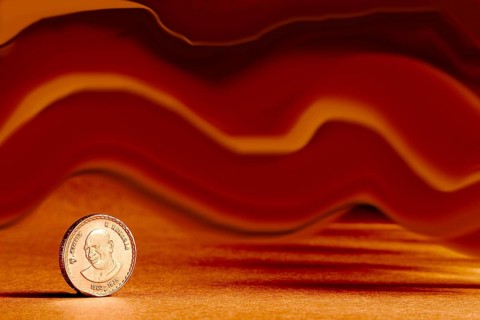 One single Indian currency five rupees coin and artistic background backside embossed K. Kamaraj