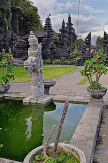 Stone mythological figure and water basin at the Goa-Lawah Temple, Bat Temple, Bali, Indonesia,