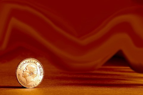 One single Indian currency one rupees coin and artistic background backside embossed Jawaharlal