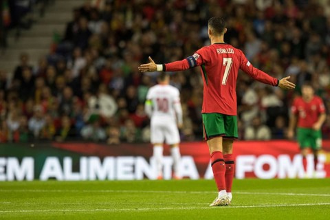 Football match, captain Cristiano RONALDO CR7 Portugal with raised arms looking from behind with