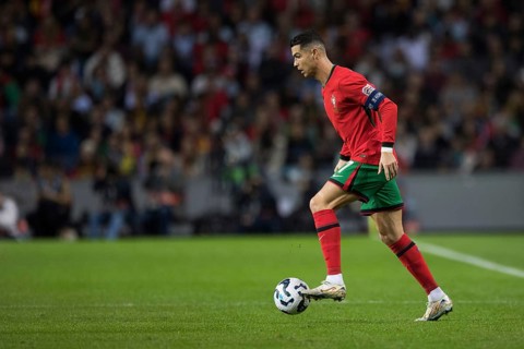 Football match, captain Cristiano RONALDO CR7 Portugal runs with the ball on his left foot to the