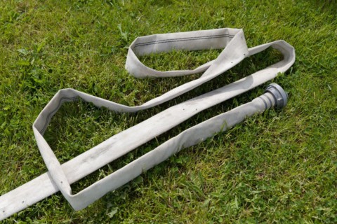 Fire hose in a meadow