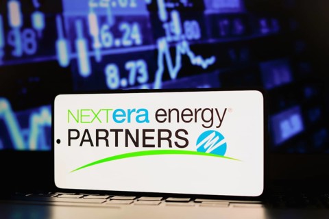 In this photo illustration, the NextEra Energy Partners LP logo is displayed on a smartphone screen
