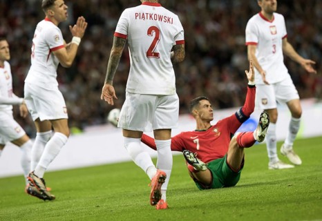 Football match, captain Cristiano RONALDO CR7 Portugal centre has just been fouled and is sitting
