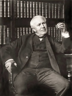 Thomas Alva Edison examining his phonograph recording apparatus, digitally edited