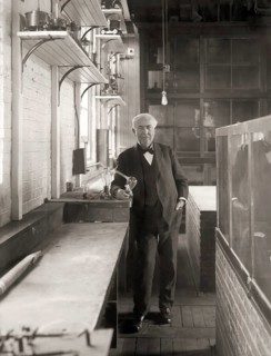 Thomas Alva Edison with his lightbulb, digitally edited