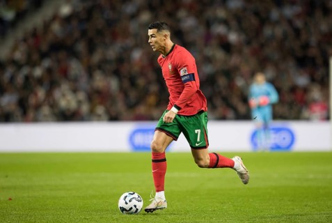 Football match, captain Cristiano RONALDO CR7 Portugal on the ball running towards the left