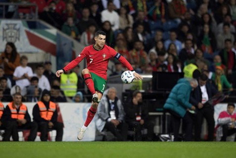 Football match, captain Cristiano RONALDO CR7 Portugal takes the ball in the air with his left foot