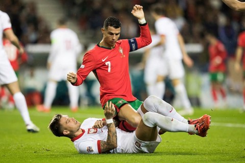 Football match, captain Cristiano RONALDO CR7 Portugal on the stomach and partly on the abdomen of