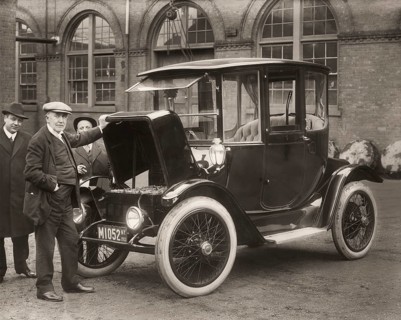 Thomas Alva Edison displaying storage batteries of the power Detroit Electric automobile, 1913,