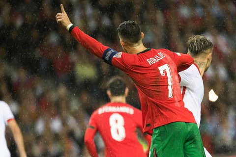 Football match, captain Cristiano RONALDO CR7 Portugal looking from behind in the rain, with