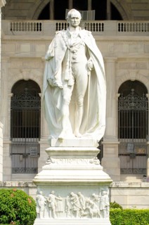 Statue of Lord Curzon stands in front of his creation of Victoria Memorial monument built between