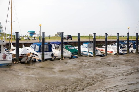 Ships and pleasure boats moored in Sielhafen am Wadden Sea, Wremen, Cuxhaven, Lower Saxony