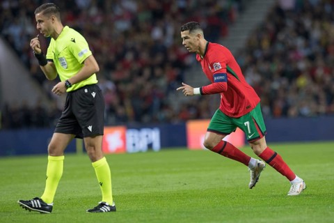 Football match, referee Donatas RUMSAS LTU left whistles for a free kick, captain Cristiano RONALDO