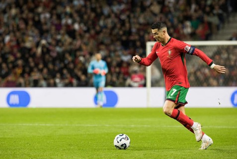 Football match, captain Cristiano RONALDO CR7 Portugal on the ball running towards the left facing