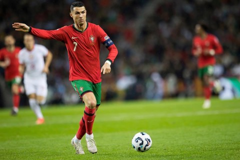 Football match, captain Cristiano RONALDO CR7 Portugal on the ball, captain's armband, left arm