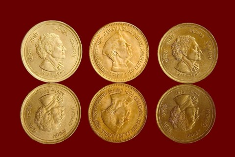 Three Indian currency five rupees coins with reflection backside embossed in middle Jawaharlal