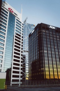 Two modern buildings with the focus on their glass facades at sunset, Auckland, New Zealand,
