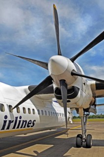 Propeller aircraft, prop jet Fokker 50, former Riau Airlines, at the airport in Labuan Bajo, Flores