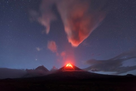 Beautiful volcanic landscape of Kamchatka Peninsula: night view of eruption active Klyuchevskaya