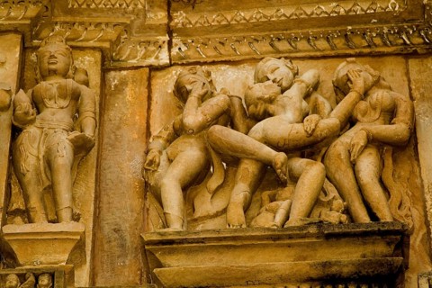 Erotica sculpture background covering her face in shame acrobatic positions of Khandariya Mahadev