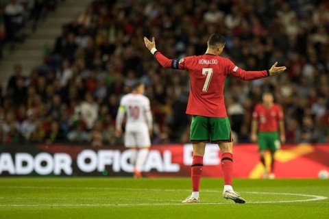 Football match, captain Cristiano RONALDO CR7 Portugal with raised arms I can't change it looking