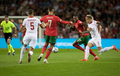 Football match, Cristiano RONALDO CR7 Portugal centre, left Jan BEDNAREK Poland, right Rafael LEAO